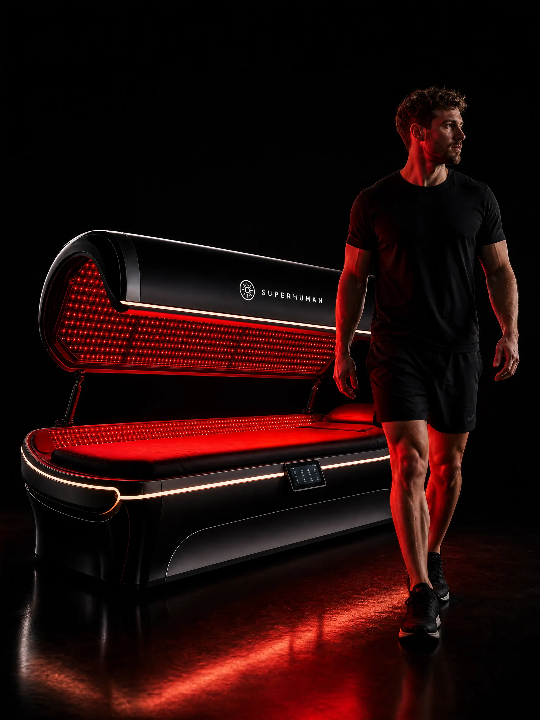 Guest stepping out of a red light therapy bed after a session